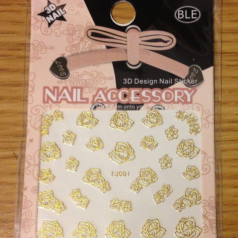 Rose gold nail art featuring geometric patterns and glitter gradients
