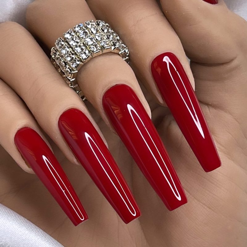 classic red nail designs for a party with glitter accents