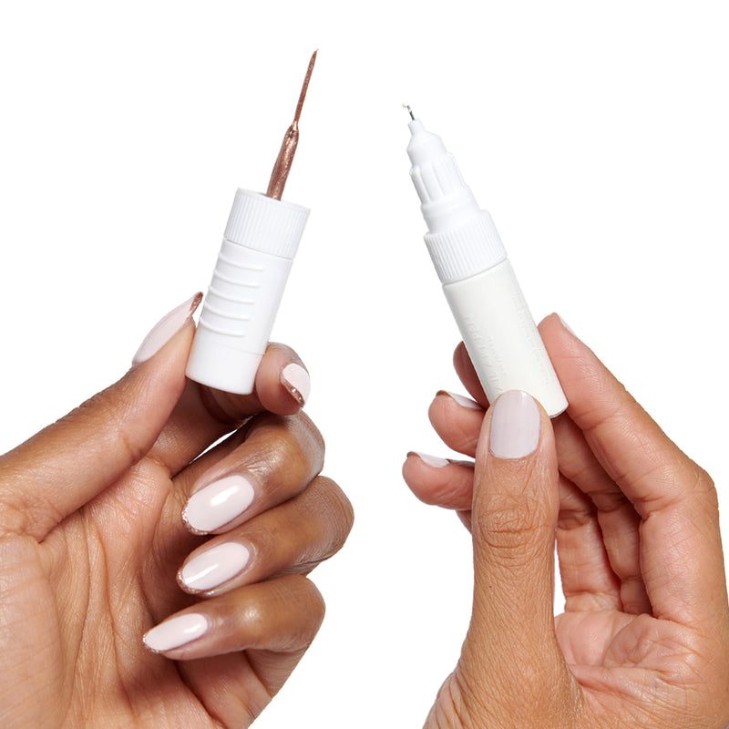 close-up of a nail art pen crafting detailed nail art design