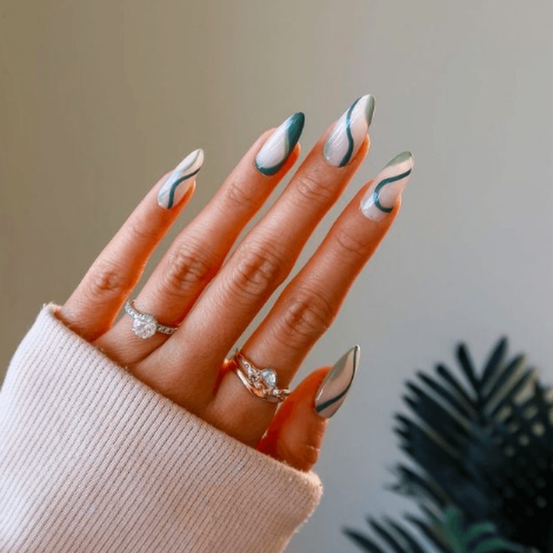 close-up of nails featuring colorful artistic swirl nail designs
