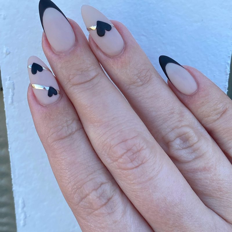 Glossy black nails showcasing edgy manicure ideas for Valentine's Day