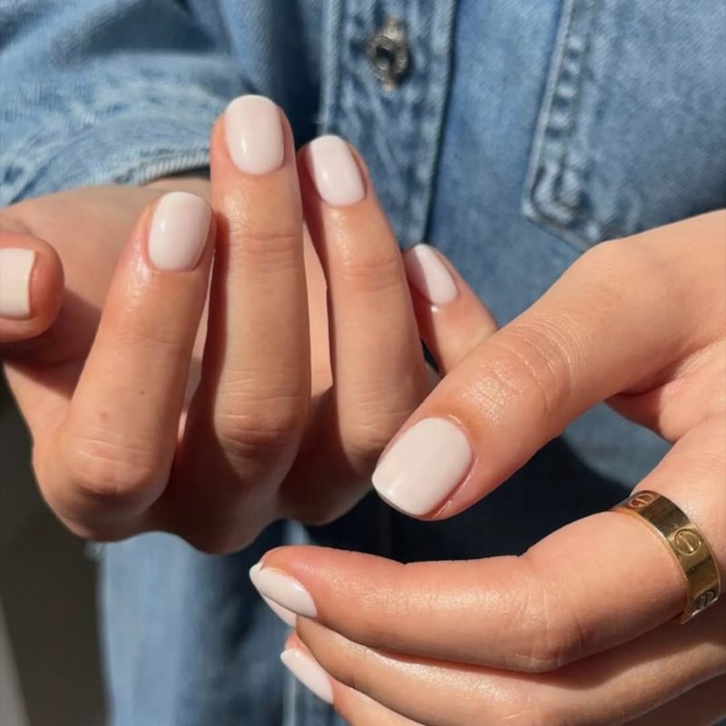 modern white nail tips with geometric accents