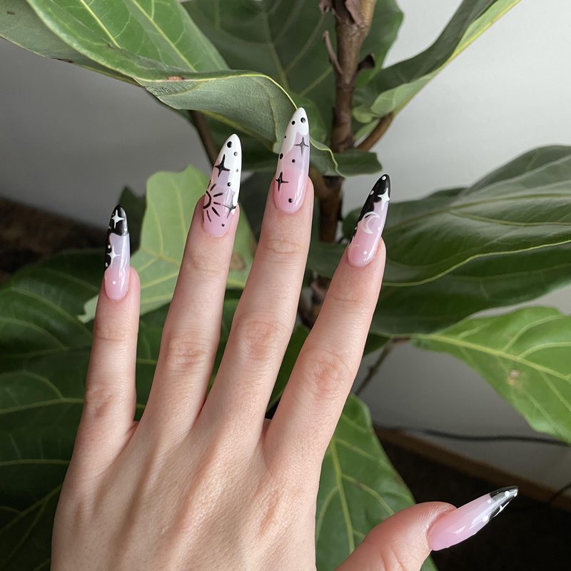 sun nail design combined with minimalist black and white nail art
