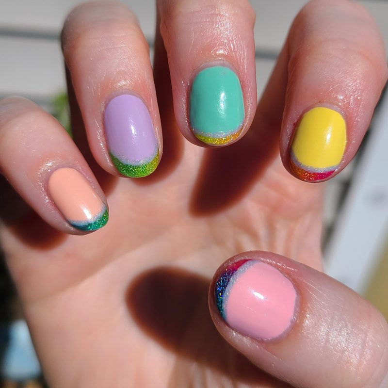 bright and pastel colored french tip nails featuring summer nail trends