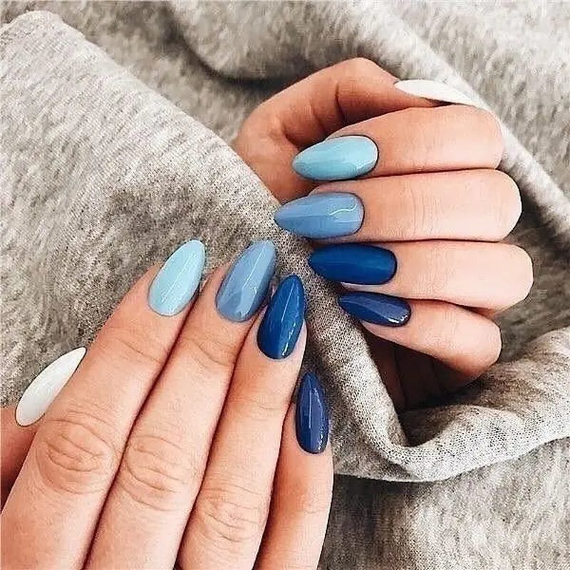 close-up of different shades of blue nails showing versatility for blue nail art