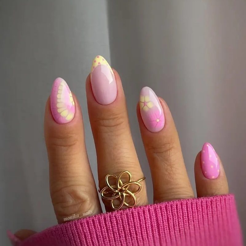 collection of pastel acrylic nails with floral and geometric designs