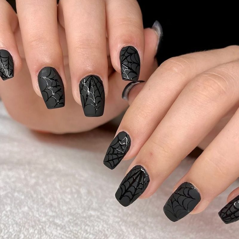 creative matte nail art featuring geometric and floral designs on matte finish nails