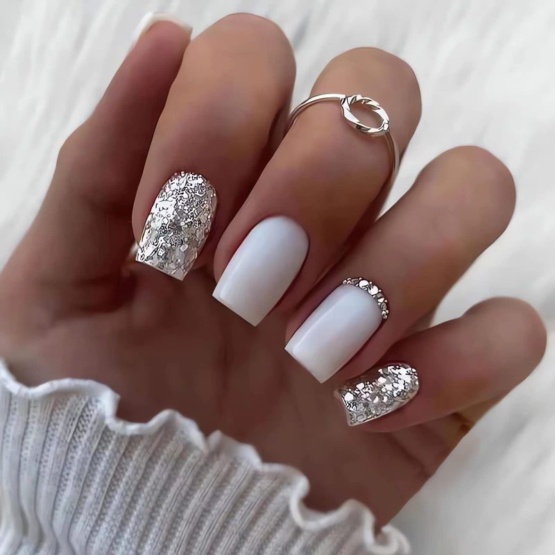 Marble and minimalist white press on nail designs with glitter accents