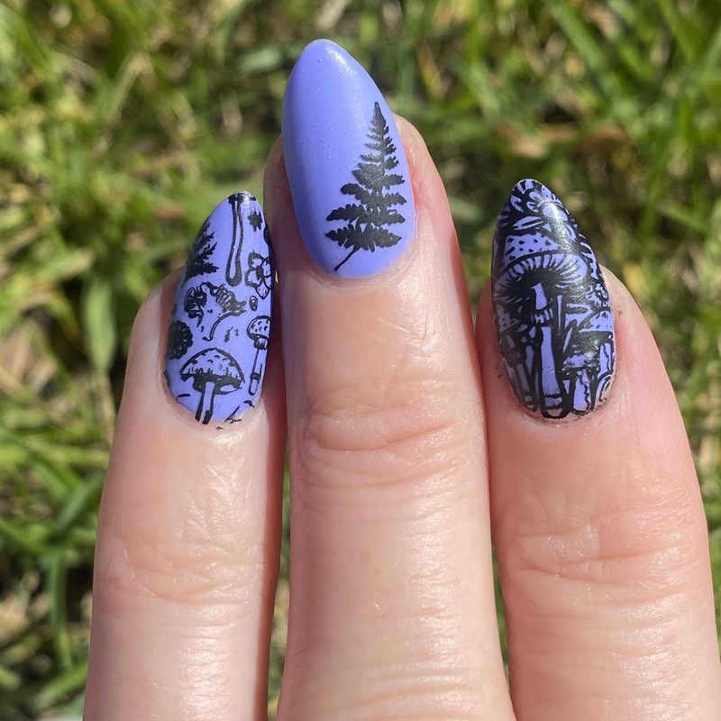 nail artist applying hand-painted custom nail art designs