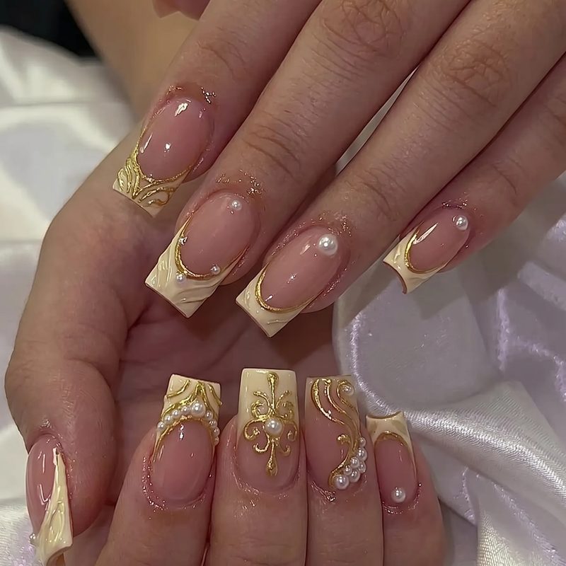 Nails combining classic French tips with modern dark and metallic elements