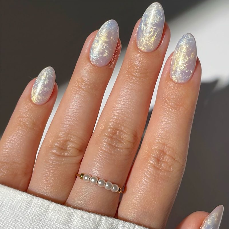 pearl nail designs displayed on coffin, stiletto, and short nail shapes