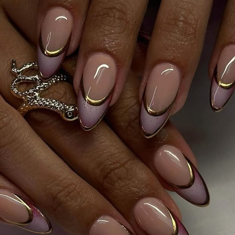 purple tip nails with gold accent lines creating elegant nail designs