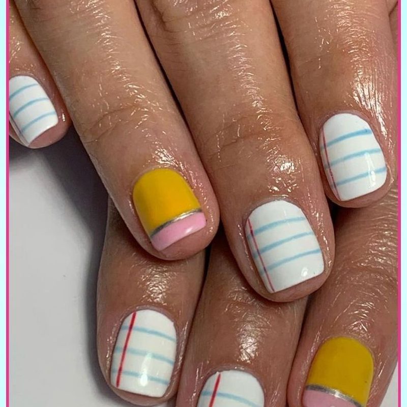 simple pastel back to school nails with subtle glitter accents