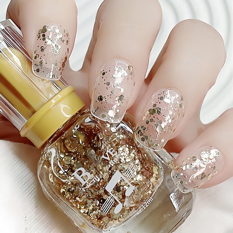 various glitter nail polishes in silver, gold, and holographic shades