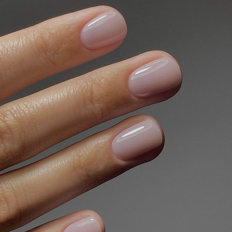 woman applying cuticle oil to matte finish nails for manicure maintenance